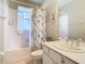 Clean bathroom with a shower/tub combo and white vanity at 304 Sorrento Road, Poinciana, FL 34759