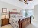 Spacious bedroom with a king-size bed and sitting area at 304 Sorrento Road, Poinciana, FL 34759