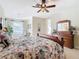 Main bedroom with a king bed and ensuite bathroom at 304 Sorrento Road, Poinciana, FL 34759