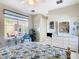Bright bedroom with a queen bed, dresser, and patio access at 304 Sorrento Road, Poinciana, FL 34759