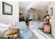 Bedroom with sitting area and adjacent bathroom at 304 Sorrento Road, Poinciana, FL 34759