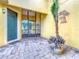 Private courtyard with brick pavers and plants at 304 Sorrento Road, Poinciana, FL 34759