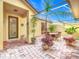 Covered patio with seating area and plants at 304 Sorrento Road, Poinciana, FL 34759