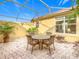 Private courtyard with seating area and plants at 304 Sorrento Road, Poinciana, FL 34759