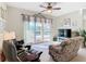 Gathering room with comfortable seating and pool access at 304 Sorrento Road, Poinciana, FL 34759