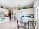Bright kitchen with breakfast nook and view into laundry room at 304 Sorrento Road, Poinciana, FL 34759