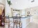 Kitchen boasts a breakfast bar with seating for two at 304 Sorrento Road, Poinciana, FL 34759