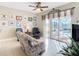 Spacious living area with sliding doors leading to a pool and patio at 304 Sorrento Road, Poinciana, FL 34759