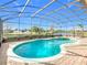 Relaxing kidney-shaped pool with screened enclosure at 304 Sorrento Road, Poinciana, FL 34759