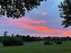 Scenic sunset view over the community's green space at 3306 Sagebrush St, Harmony, FL 34773