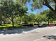 Park with green grass, trees, and parked cars at 3306 Sagebrush St, Harmony, FL 34773