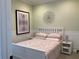 Bright guest bedroom with a queen-size bed and decorative wall art at 3306 Sagebrush St, Harmony, FL 34773