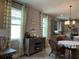 Kitchen features a dining area with chandelier at 3306 Sagebrush St, Harmony, FL 34773