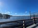 Serene waterfront view with a dock and boat at 3306 Sagebrush St, Harmony, FL 34773