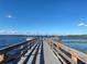 Wooden dock extends to lake with boats parked at 3306 Sagebrush St, Harmony, FL 34773