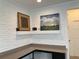 Home office with white brick feature wall and built-in desk at 3306 Sagebrush St, Harmony, FL 34773