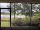 Relaxing screened porch overlooking serene lake at 3306 Sagebrush St, Harmony, FL 34773