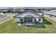 Aerial view of backyard with screened-in patio and grassy area at 5068 Tennessee Lake Dr, Auburndale, FL 33823