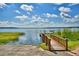 Private lake access with wooden dock and walkway at 5068 Tennessee Lake Dr, Auburndale, FL 33823