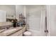 Clean bathroom with a shower/tub combo and granite vanity at 5109 Barombi Bnd, Saint Cloud, FL 34772