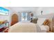 Spacious bedroom with large bed and window at 5109 Barombi Bnd, Saint Cloud, FL 34772