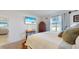 Bright bedroom with a large bed and TV at 5109 Barombi Bnd, Saint Cloud, FL 34772