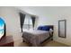 Cozy bedroom with a queen-size bed and ample closet space at 5109 Barombi Bnd, Saint Cloud, FL 34772