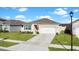 One story home with a two car garage and well maintained lawn at 5109 Barombi Bnd, Saint Cloud, FL 34772