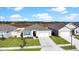 One-story house with a two-car garage and a landscaped yard at 5109 Barombi Bnd, Saint Cloud, FL 34772