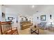 Open living room offers comfortable seating and views into dining area at 5109 Barombi Bnd, Saint Cloud, FL 34772