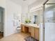 Clean bathroom with double vanity and tiled shower at 512 Heartwell Dr, Poinciana, FL 34759