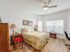 Bright bedroom with large window and hardwood floors at 512 Heartwell Dr, Poinciana, FL 34759