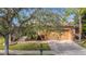House exterior with a driveway and landscaping at 512 Heartwell Dr, Poinciana, FL 34759