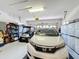 Garage with golf cart and plenty of storage at 512 Heartwell Dr, Poinciana, FL 34759