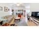 Spacious living room with comfortable seating and access to a sunroom at 512 Heartwell Dr, Poinciana, FL 34759