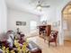 Comfortable living room with leather sofa and ceiling fan at 512 Heartwell Dr, Poinciana, FL 34759