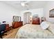 Spacious main bedroom with light wood furnishings and ceiling fan at 512 Heartwell Dr, Poinciana, FL 34759