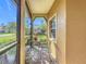 Cozy screened porch with seating for relaxing outdoors at 512 Heartwell Dr, Poinciana, FL 34759