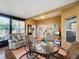 Relaxing sunroom with seating and view of backyard at 512 Heartwell Dr, Poinciana, FL 34759