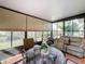 Bright sunroom with seating area and view of garden at 512 Heartwell Dr, Poinciana, FL 34759