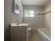 Clean bathroom with a tub shower combo, single vanity, and tile floors at 907 Columbia St, Orlando, FL 32805