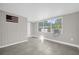 Second bedroom with wood-like wall and large window at 907 Columbia St, Orlando, FL 32805