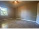 Spacious bedroom with tile floors and a window with natural light at 907 Columbia St, Orlando, FL 32805