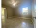 Bright bedroom featuring tile floors and ceiling fan at 907 Columbia St, Orlando, FL 32805