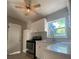 Renovated kitchen with white cabinets and modern appliances at 907 Columbia St, Orlando, FL 32805