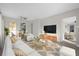 Bright living room featuring a comfy sofa, and a large TV at 907 Columbia St, Orlando, FL 32805