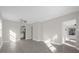 Open living area with tile floors and views into kitchen area at 907 Columbia St, Orlando, FL 32805