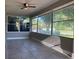Bright sunroom with tile floors and large windows at 907 Columbia St, Orlando, FL 32805