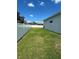 Fenced backyard with grassy area at 932 Albertville Ct, Kissimmee, FL 34759