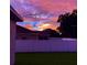 Peaceful backyard view at sunset with privacy fence at 932 Albertville Ct, Kissimmee, FL 34759